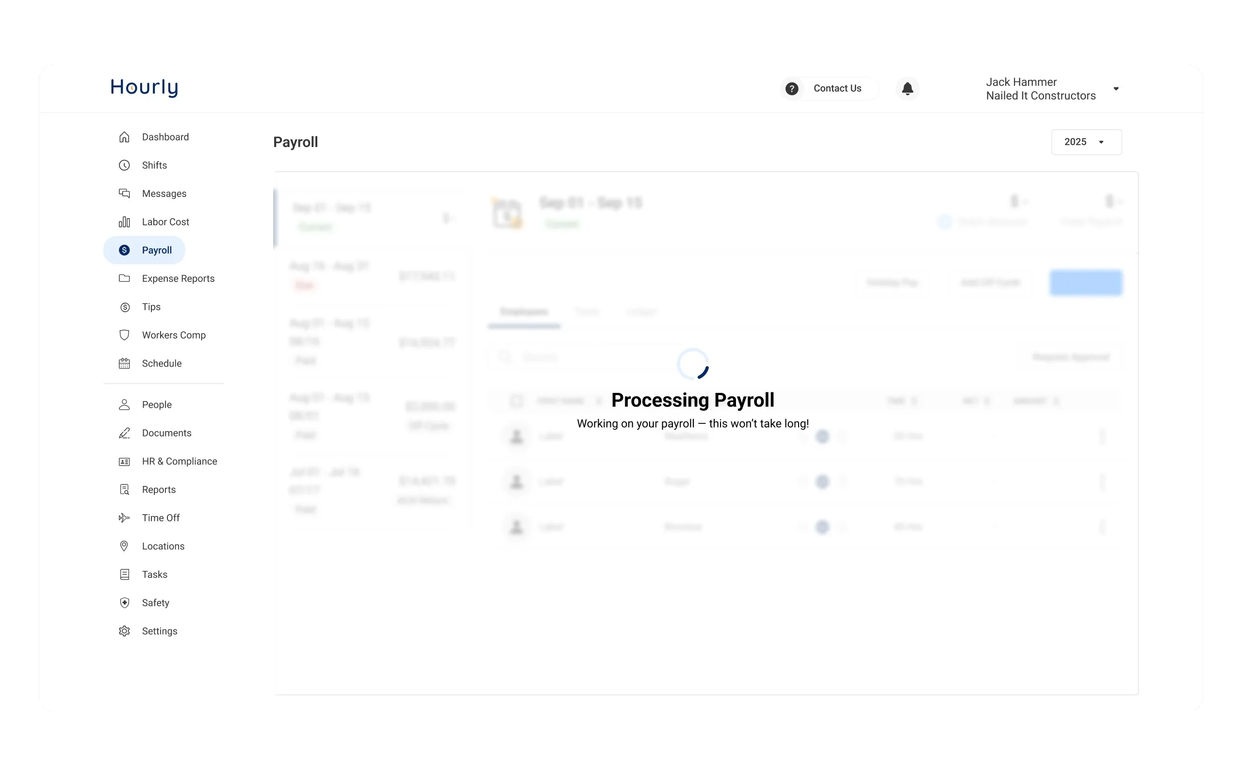 The processing state, showing a spinner and a Processing Payroll message over the dimmed payroll table so the run is never ambiguous.