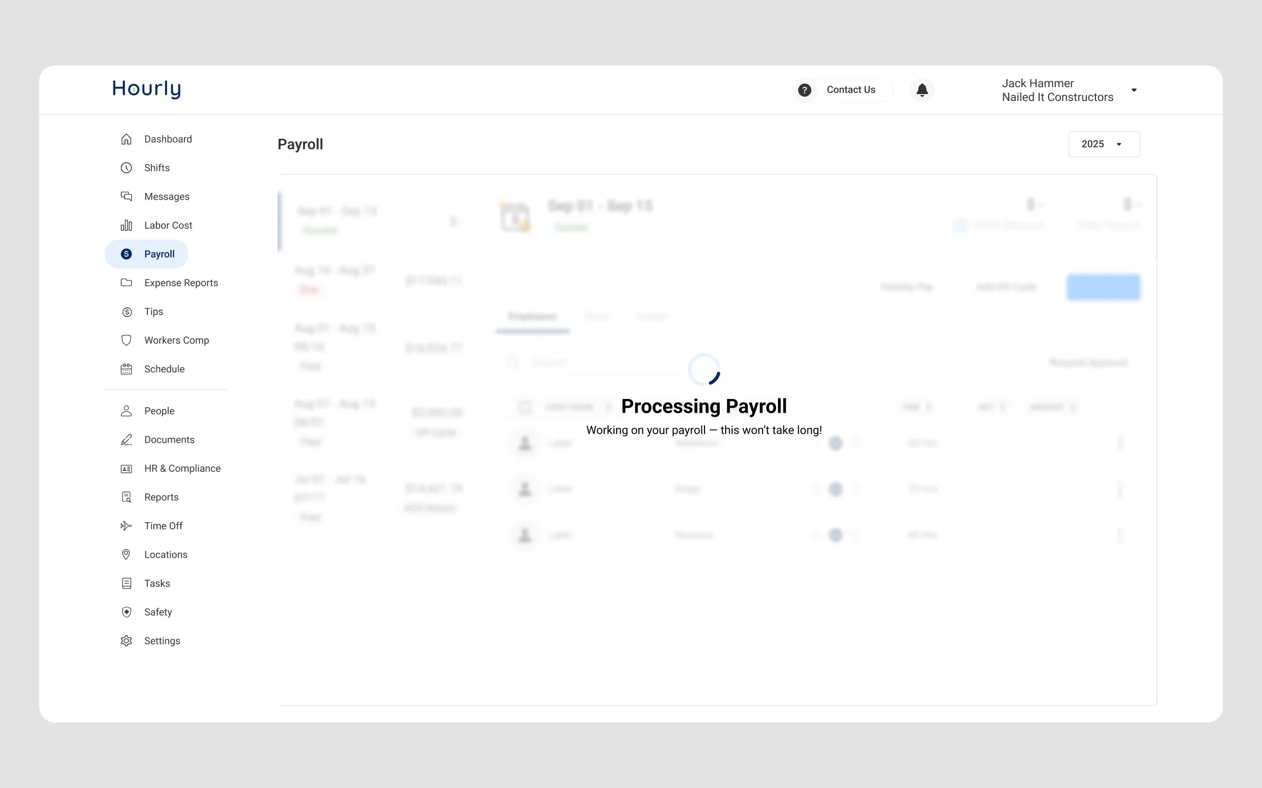 The processing state, showing a spinner and a Processing Payroll message over the dimmed payroll table so the run is never ambiguous.